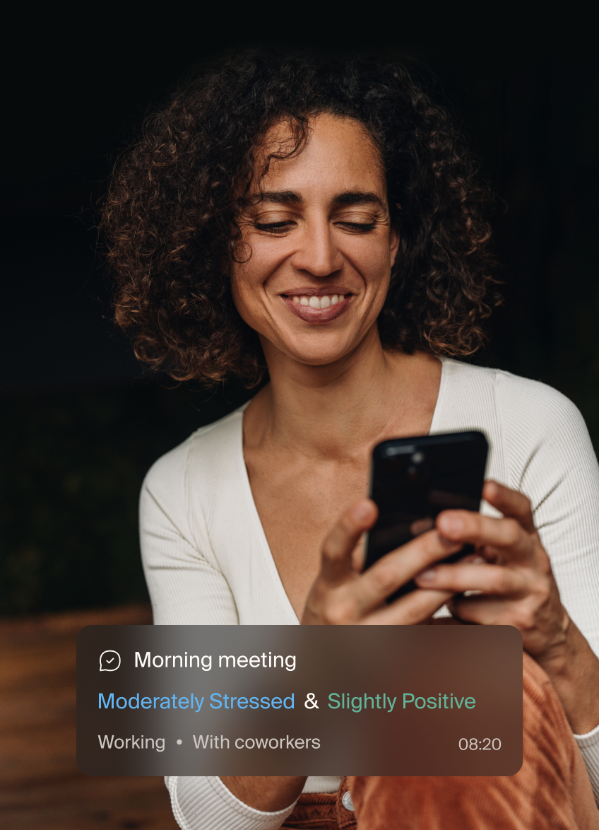Smiling woman looking at her phone Smiling woman looking at her phone